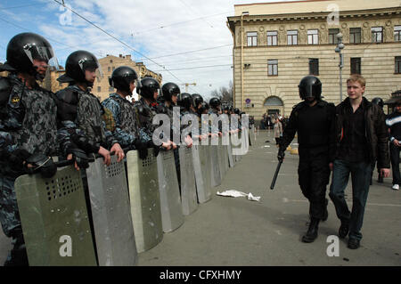 Riot police OMON arresting participants of the `Dissenters` March in St.Petersburg. Protesters shouted for St.Petersburg`s Governor Valentina Matviyenko to resign and called President Vladimir Putin an enemy of the state. Stock Photo